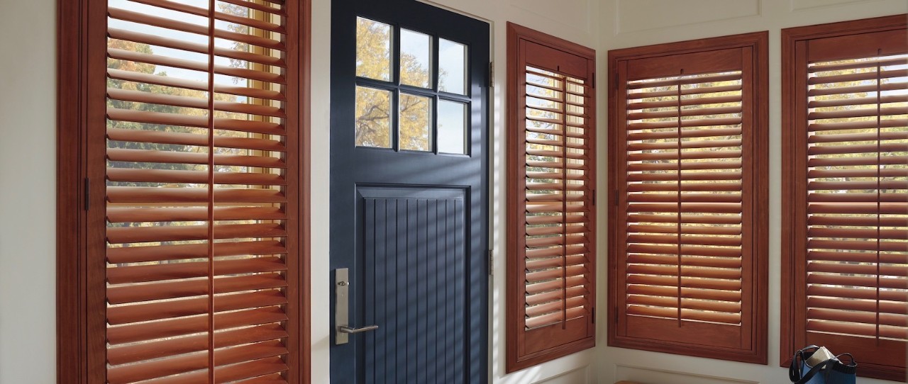 Indoor wood shutters and black front door